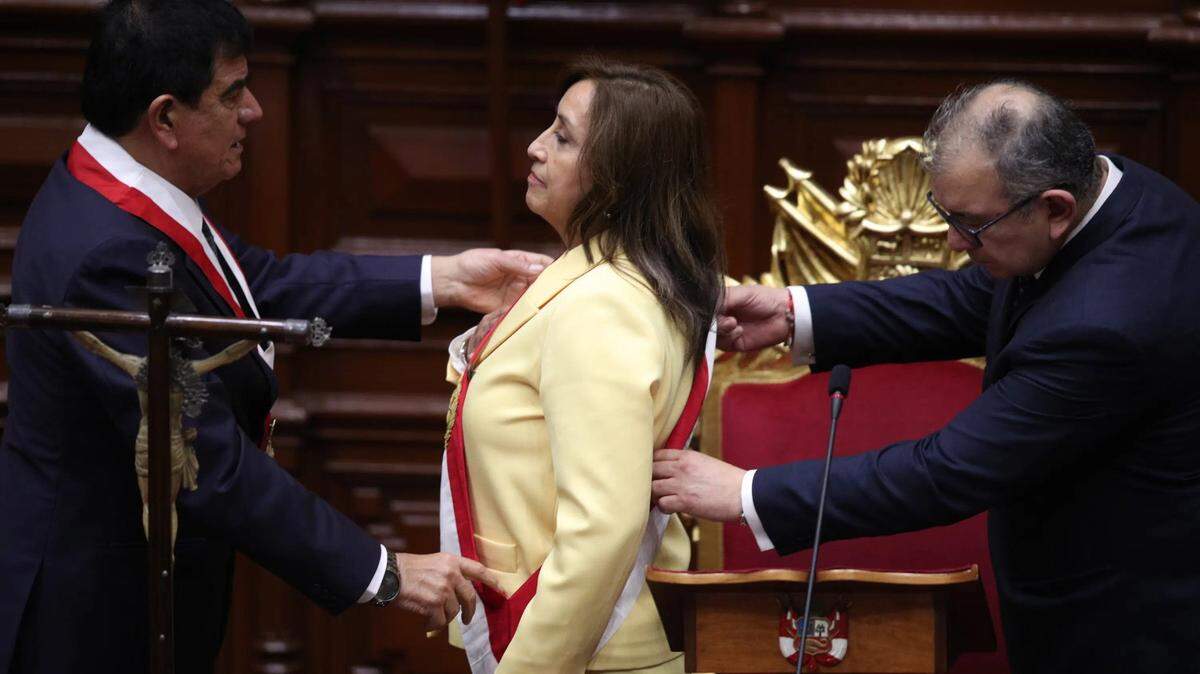 Former Vice President Dina Boluarte receives the presidential sash as she is sworn in as the new president at Congress in Lima on Dec. 7.
