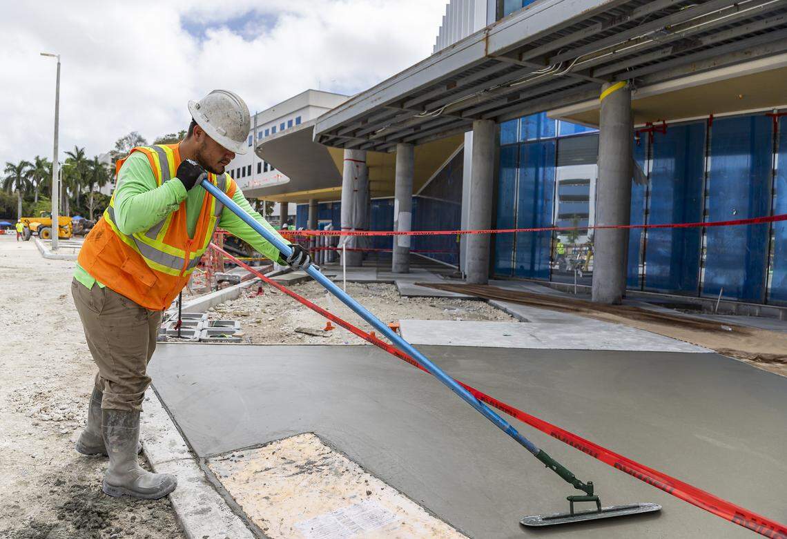 Construction crews work on the exterior of Jackson Memorial Hospital's new emergency department on Thursday, March 5, 2026, in Miami, Fla. The new facility doubles the size of their current emergency room and is expected to reduce patient wait times.