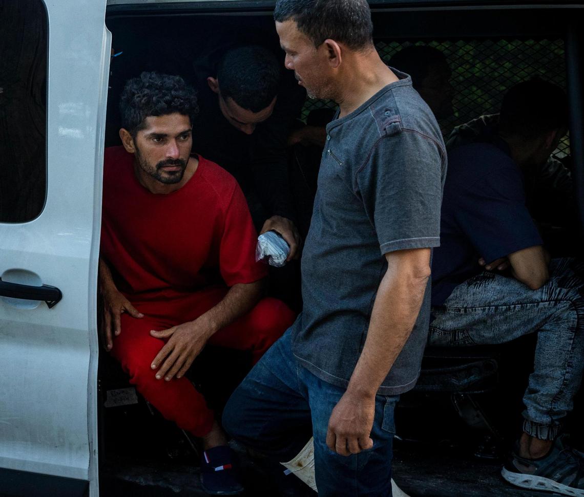 Cuban migrants in a Customs and Border Protection vehicle wait to be taken for processing. A group of Cuban migrants landed in Key Largo, Florida, early Sunday morning, Jan. 8, 2023.