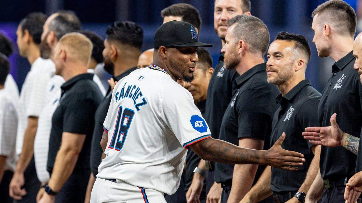 Miami Marlins pitcher Sixto Sanchez gives high fives during lineup introductions prior to Opening Day against the Pittsburgh Pirates at LoanDepot Park in Miami, Florida, on Thursday, March 28, 2024.