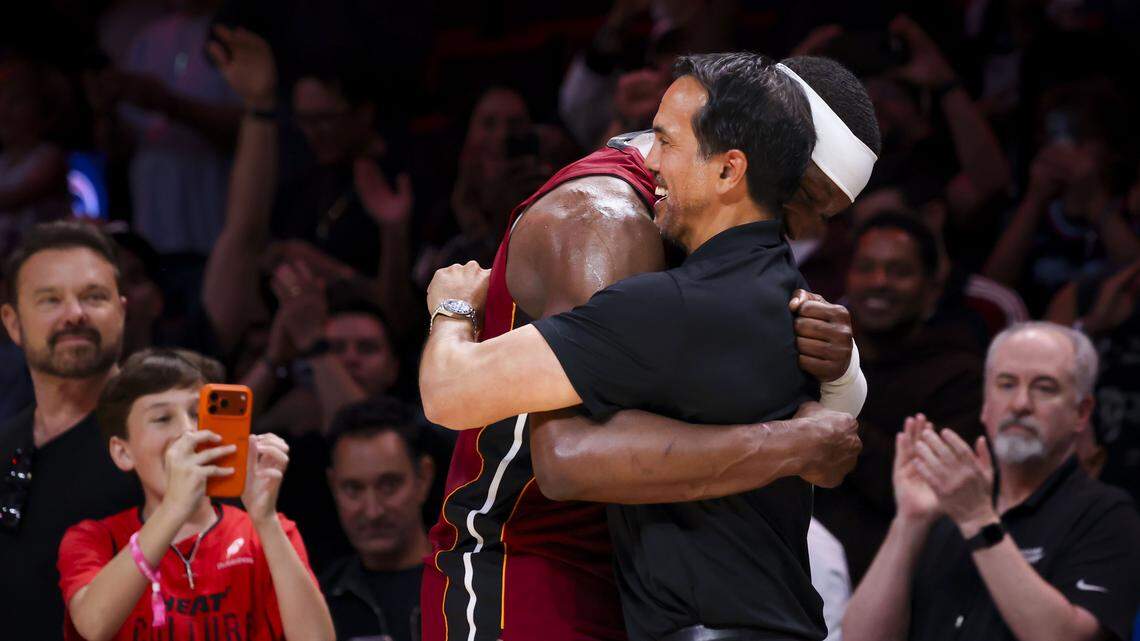 Miami Heat center Bam Adebayo (13) hugs head coach Erik Spoelstra during the second half of a basketball game after he scored 83 points against the Washington Wizards on Tuesday, March 10, 2026, at Kaseya Center in downtown Miami.