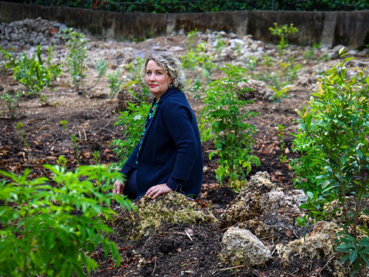 Chelsea Wilkerson, CEO of the Girls Scouts of Tropical Florida, sits among the newly planted trees after announcing the reception of $450,000 in federal funding to continue the restoration of the hardwood hammock where the Girls Scouts have camped in for the last 75 years on Wednesday, May 8, 2024 at Camp Mahachee in Coral Gables, Florida.