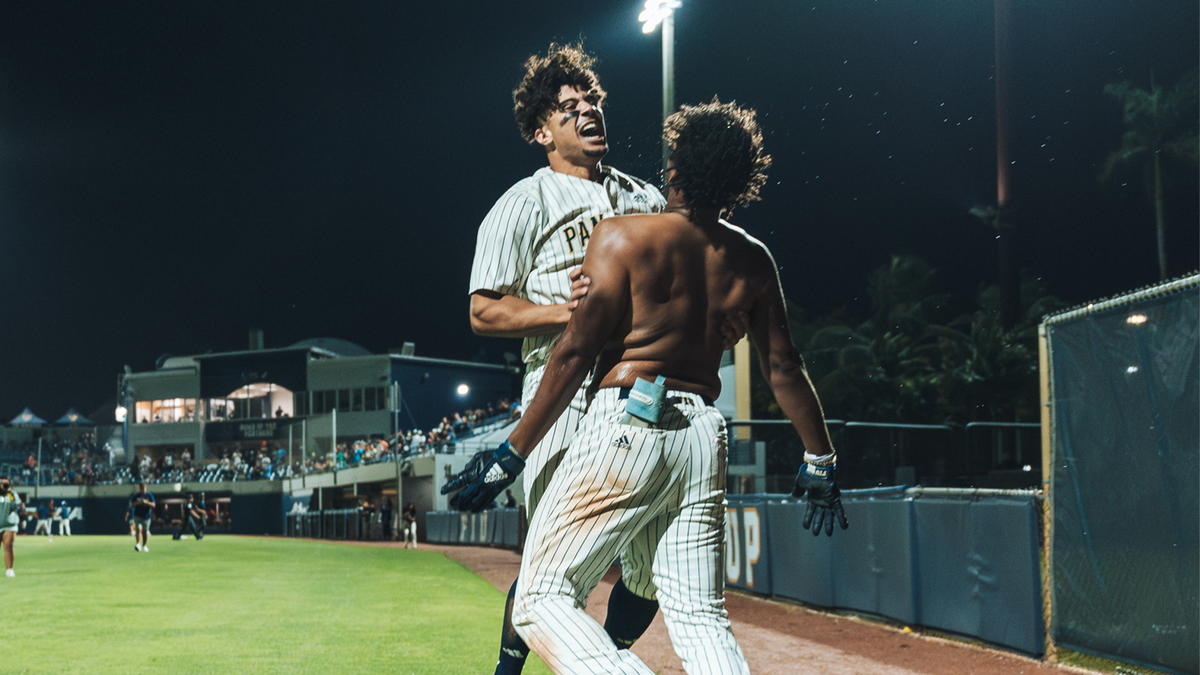 FIU’s Brylan West celebrates with a teammate after his walk-off hit on Wednesday in the bottom of the 10th inning, which helped the Panthers beat the Miami Hurricanes 5-4 at FIU Baseball Stadium in Miami.