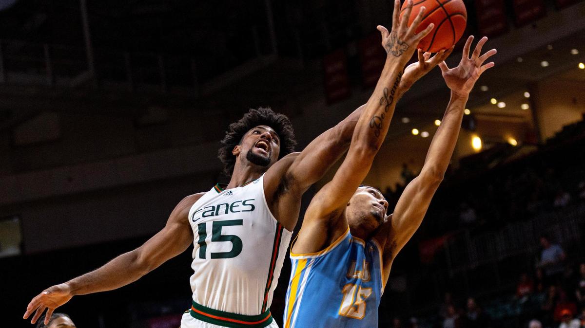 Miami Hurricanes forward Norchad Omier fights for the rebound with Long Island University center C.J. Delancy (15) during the first half of an NCAA basketball game at the Watsco Center in Coral Gables, Florida, on Wednesday, December 6, 2023.