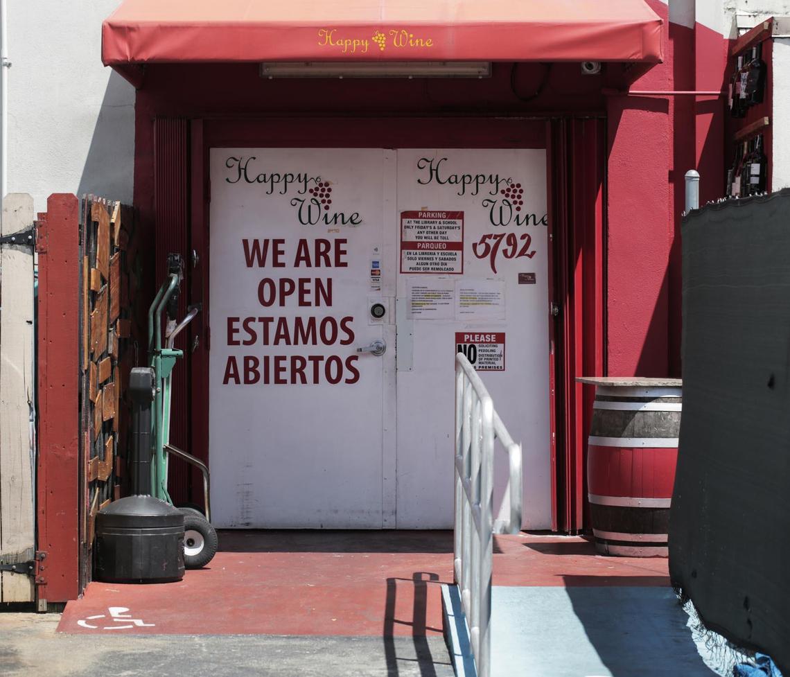 The actual entrance to the sly Happy Wine is around back, away from busy 8th Street.