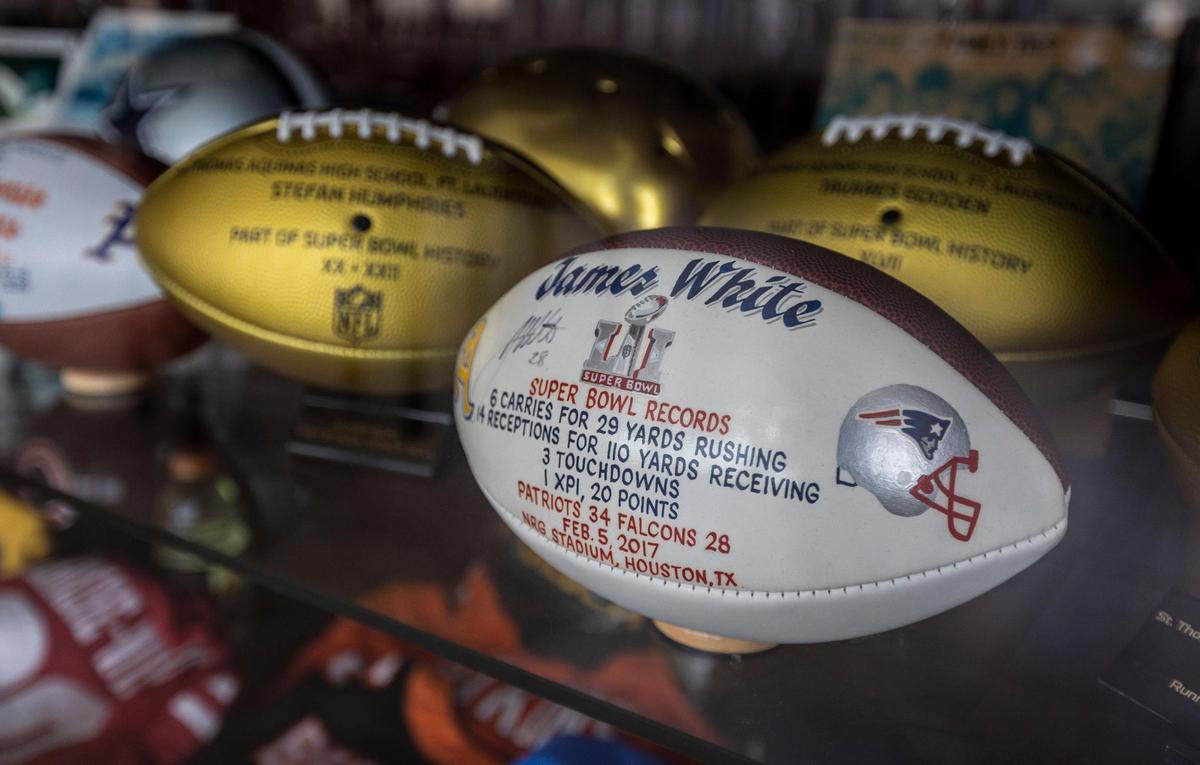 Fort Lauderdale, Florida, June 2, 2021 - Trophies and mementos on display in the offices of the Athletic Department at St. Thomas Aquinas High School in Fort Lauderdale.