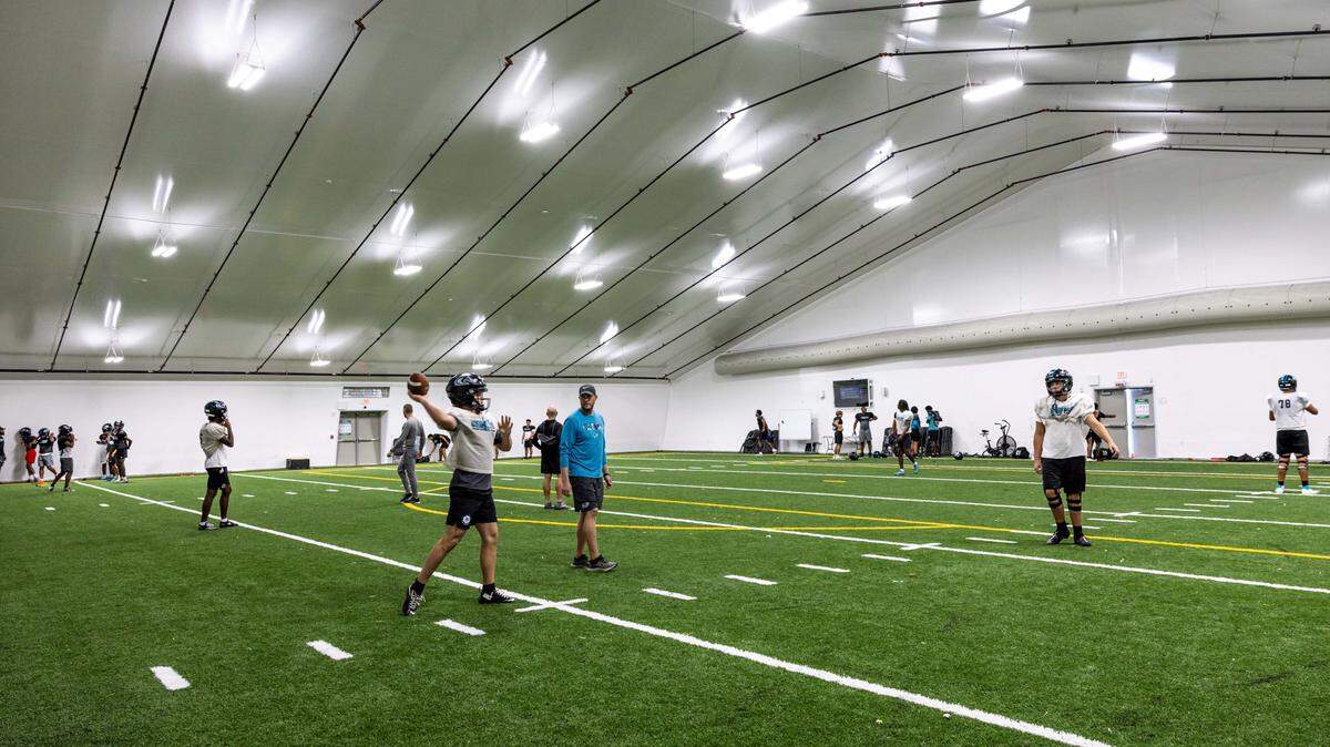 Archbishop football players practice inside the Jordan Family Foundation Athletic Center at Archbishop McCarthy on Wednesday, October 22, 2025, in Fort Lauderdale, Fla.