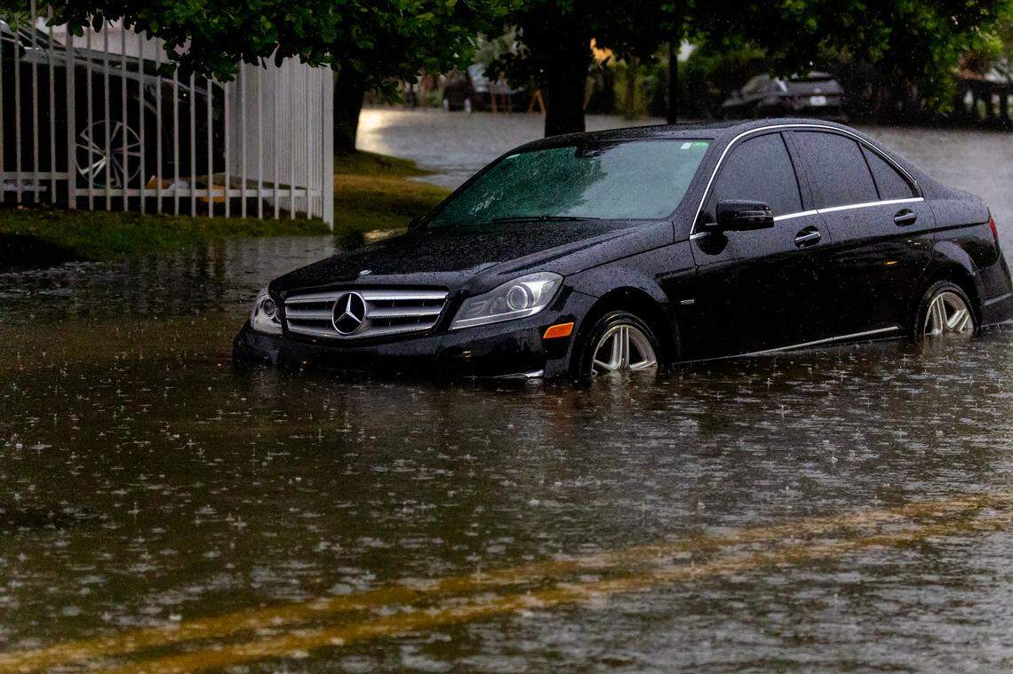 A vehicle stranded by the flooded road due to heavy rain at North Bay Rd and 180th Dr. in Sunny Isles Beach on Wednesday, June 12, 2024 in Florida.
