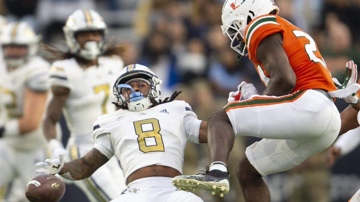 Miami safety Kamren Kinchens, right, breaks up pass intended for Georgia Tech wide receiver Nate McCollum (8) in the first half of an NCAA college football game Saturday, Nov. 12, 2022, in Atlanta. (AP Photo/Hakim Wright Sr.)