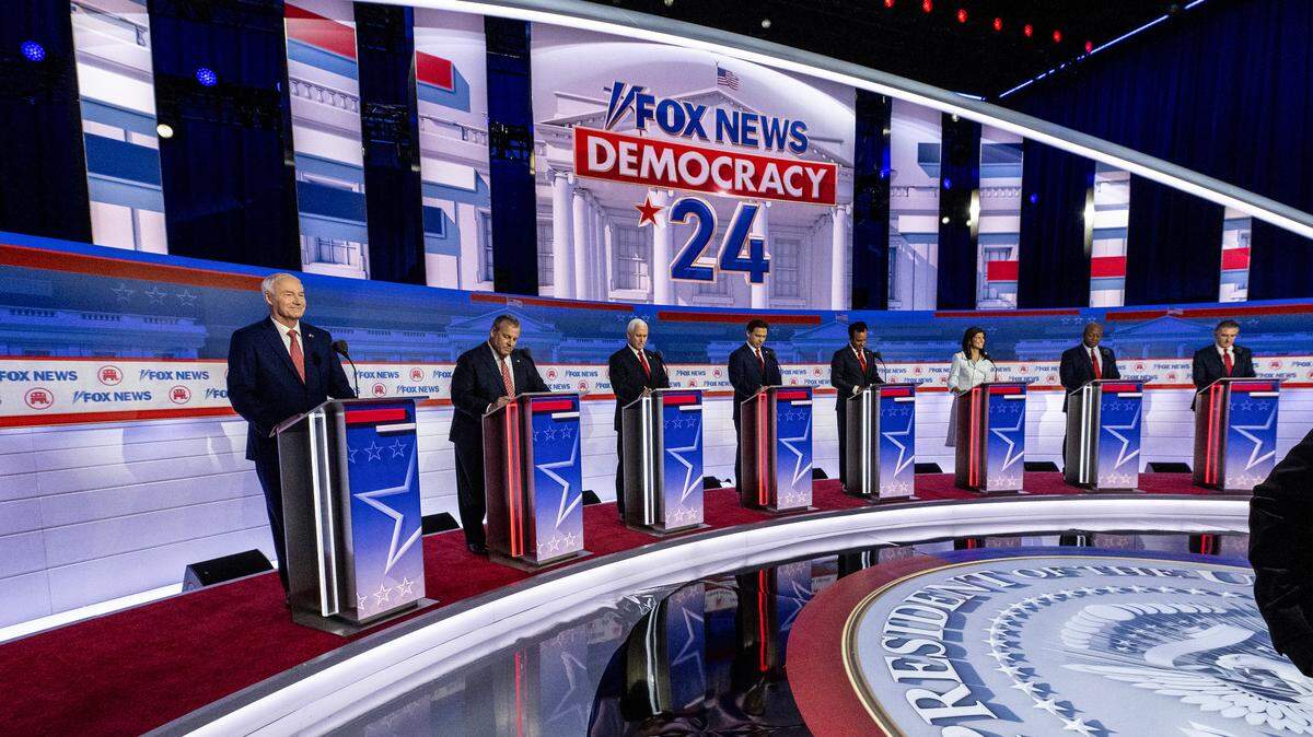 Former Arkansas Gov. Asa Hutchinson, Former New Jersey Gov. Chris Christie, Former Vice President Mike Pence, Florida Gov. Ron DeSantis, Vivek Ramaswamy, Former United Nations Ambassador Nikki Haley, Sen. Tim Scott of South Carolina, and North Dakota Gov. Doug Burgum take the stage at the Fiserv Forum for the first Republican Presidential primary debate in Milwaukee, Wisconsin, on August 23, 2023.