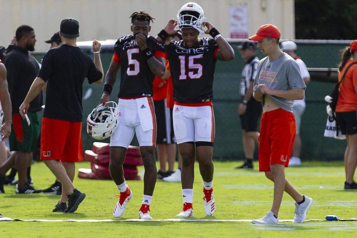 Redshirt freshman quarterback N’Kosi Perry (left) and true freshman Jarren Williams (right) shown at practice before the season began. Both were suspended at differnt points this season.