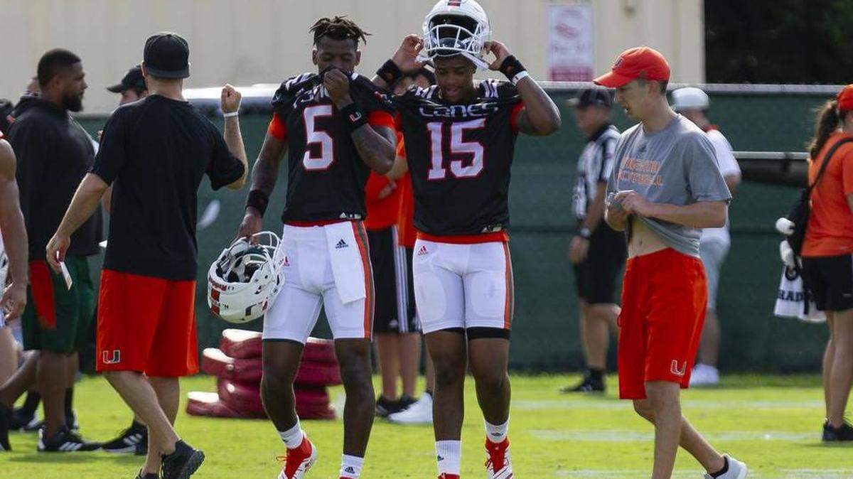 Redshirt freshman quarterback N’Kosi Perry (left) and true freshman Jarren Williams (right) shown at practice before the season began. Both were suspended at differnt points this season.