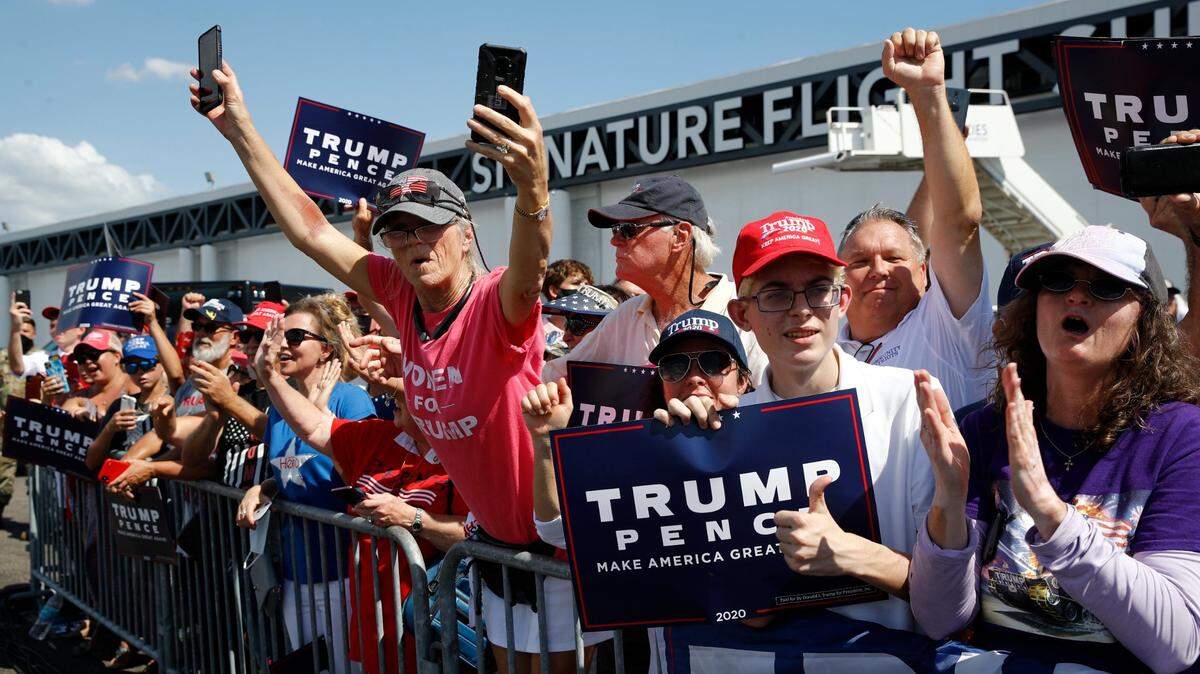 Supporters cheer as President Donald Trump speaks during a campaign event with Florida Sheriffs in Tampa, Fla., Friday, July 31, 2020.