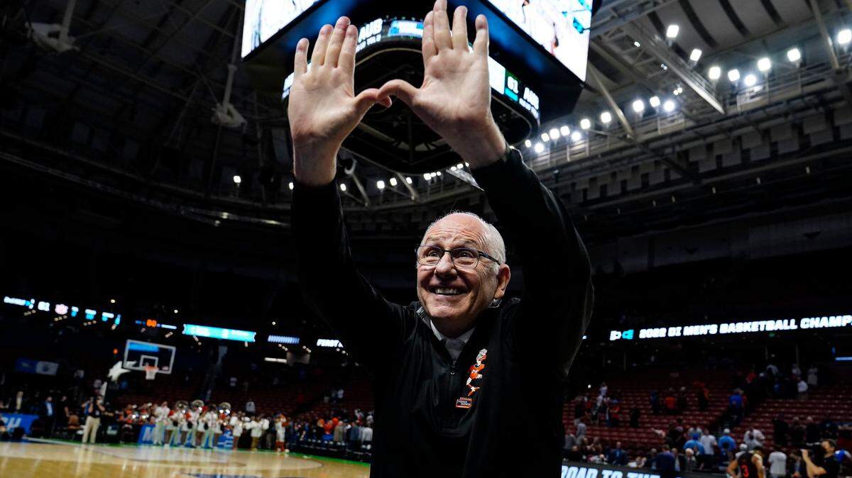 Miami head coach Jim Larranaga cheers with fans after a win over Auburnin a college basketball game in the second round of the NCAA tournament Sunday, March 20, 2022, in Greenville, S.C. (AP Photo/Brynn Anderson)