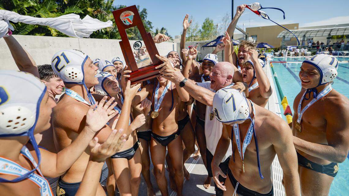 St. Thomas Aquinas High School players and coach Michael Goldenberg react after defeating Ransom Everglades in boys' water polo during the FHSAA State Championship game at Belen Jesuit School in Miami, Florida, on Saturday, April 25, 2026.