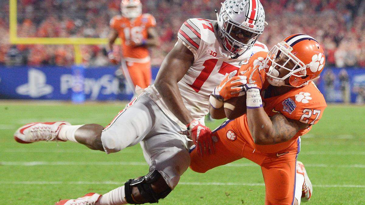 Dec 31, 2016; Glendale, AZ, USA; Clemson Tigers running back C.J. Fuller (27) catches a touchdown pass defended by Ohio State linebacker Jerome Baker (back) during the second quarter in the 2016 CFP semifinal at University of Phoenix Stadium. Mandatory Credit: Joe Camporeale-USA TODAY Sports