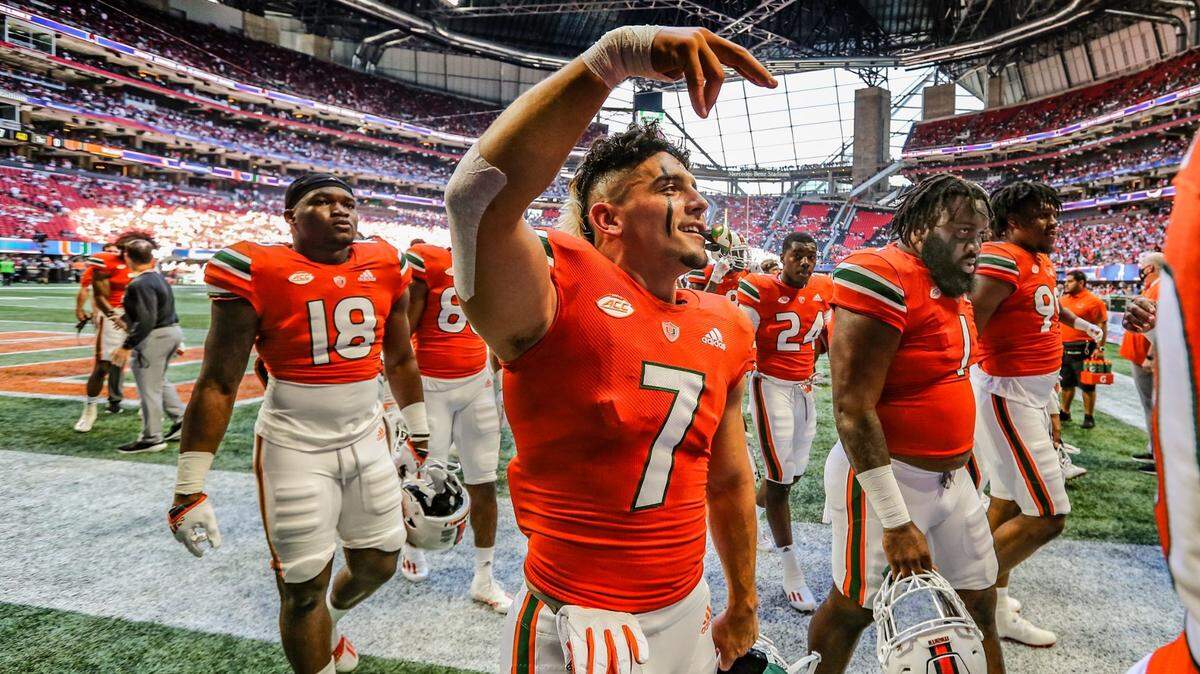Miami Hurricanes wide receiver Xavier Restrepo (7) reacts to fans during warmups before the Chick-fil-A Kickoff Game against Alabama Crimson Tide at Mercedez-Benz Stadium in Atlanta on Saturday, September 4, 2021.