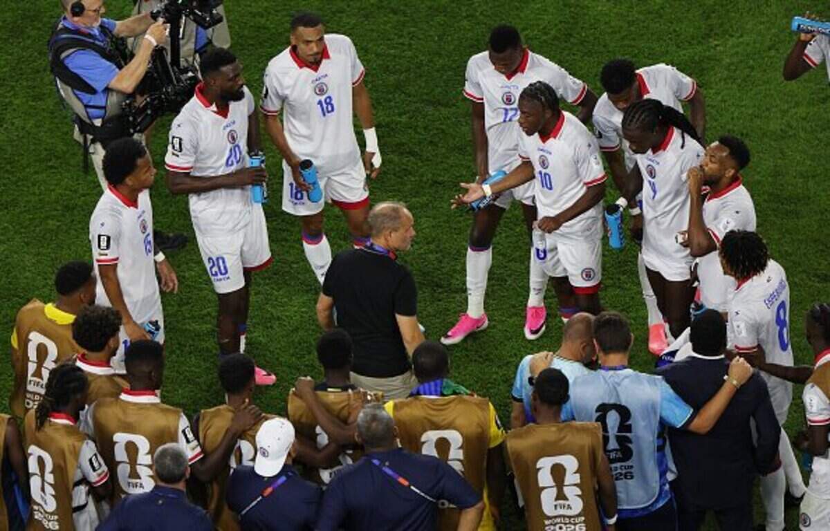 FOXBOROUGH, MASSACHUSETTS - JUNE 13: Sebastien Migne, Head Coach of Haiti, speaks to players at the hydration break during the FIFA World Cup 2026 Group C match between Haiti and Scotland at Boston Stadium on June 13, 2026 in Foxborough, Massachusetts. (Photo by Mattia Ozbot/Getty Images)