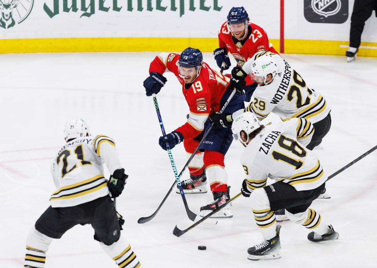 Florida Panthers left wing Matthew Tkachuk (19) tries to keep the puck from the Boston Bruins during the second period of Game 5 of a second-round Stanley Cup Playoff series on Tuesday, May 14, 2024, at Amerant Bank Arena in Sunrise, Fla.