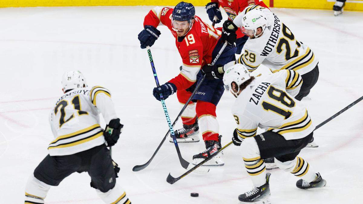 Florida Panthers left wing Matthew Tkachuk (19) tries to keep the puck from the Boston Bruins during the second period of Game 5 of a second-round Stanley Cup Playoff series on Tuesday, May 14, 2024, at Amerant Bank Arena in Sunrise, Fla.