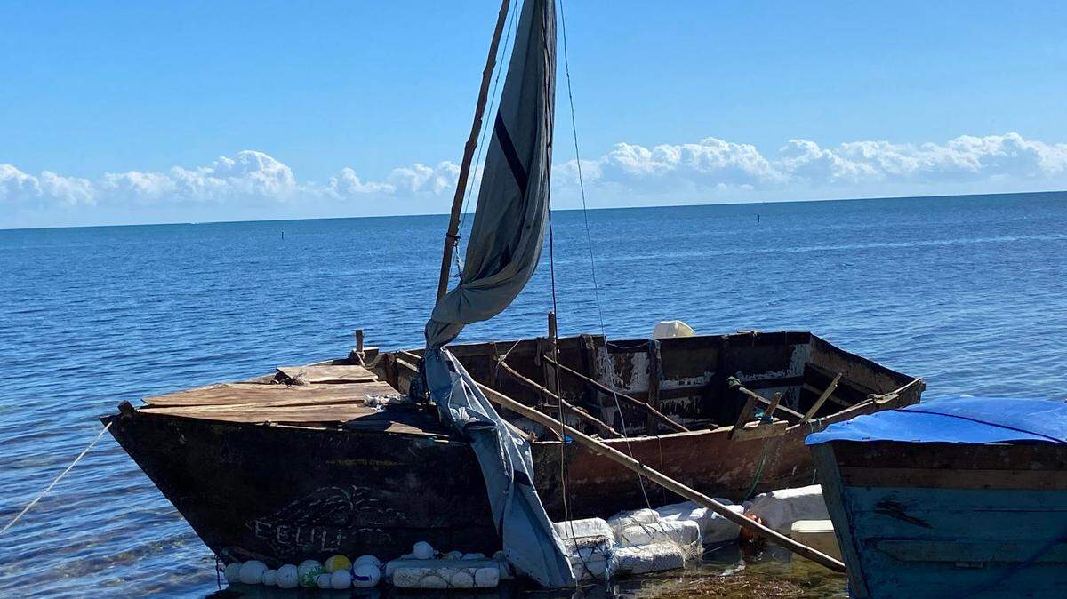 A steel-hulled, makeshift migrant sailboat is grounded near the mangroves of Harry Harris Park in the Upper Keys area of Tavernier Tuesday, Jan. 10, 2023. Florida Fish and Wildlife Conservation Commission officers found the boat adrift off Key Largo earlier that day.