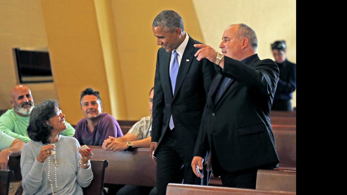 
President Obama arrives at the Ermita de la Caridad escorted by Catholic Priest Juan Rumin Dominguez in Miami on Thursday, May 28, 2015.
