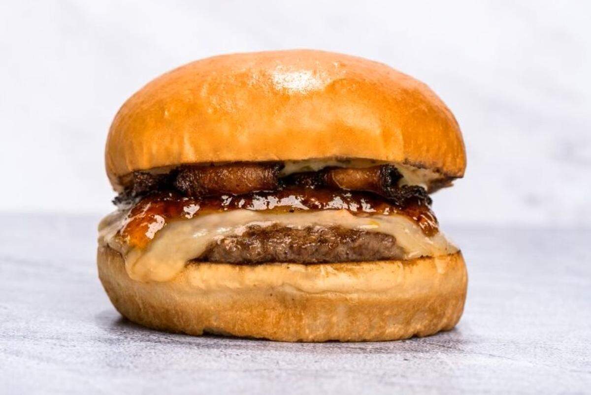The Jalapeño Delight burger, winner of the 2024 Burger Bash, is topped with jalapeño jack cheese, jalapeño bacon jam, jalapeño bacon and cilantro jalapeño aioli and served on a butter brioche bun.