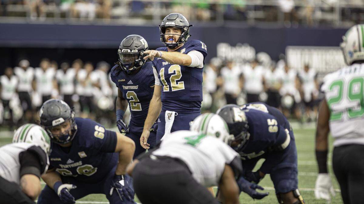 FIU quarterback James Morgan (12) prepares the offensive line against Marshall University at Riccardo Silva Stadium in Miami Nov. 24, 2018.