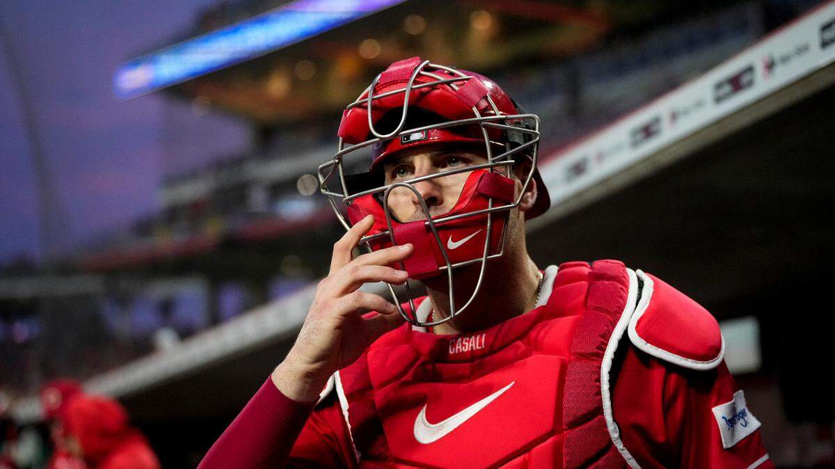 Jun 20, 2023; Cincinnati, Ohio, USA; Cincinnati Reds catcher Curt Casali (12) leaves the dugout in the top of the seventh inning against the Colorado Rockies at Great American Ball Park. Mandatory Credit: Sam Greene-USA TODAY Sports
