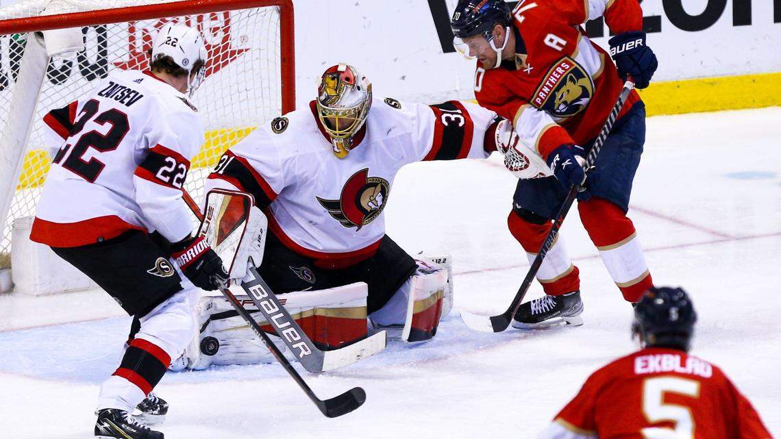 Ottawa Senators goalie Anton Forsberg (31) blocks a shot by Florida Panthers defender Aaron Ekblad (5) during the third period of an NHL game at FLA Live Arena in Sunrise, Florida, on Tuesday, December 14, 2021. The Panthers lost to the Senators 8-2, allowing the biggest loss of the season.