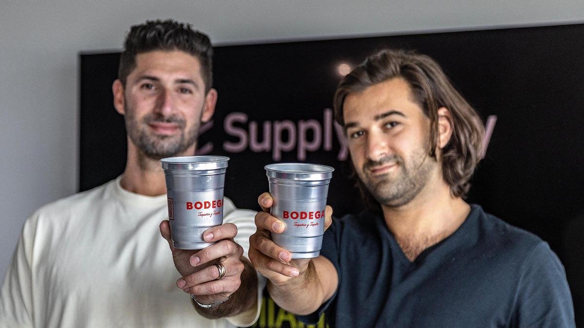 Zachary Stein, CEO at left, and Bradley Saveth run SupplyCaddy in Miami. They show cups on May 12, 2023 they produced for Bodega Taqueria restaurant. It’s one of the many clients of the company’s packaging and disposables products made for the food service industry.