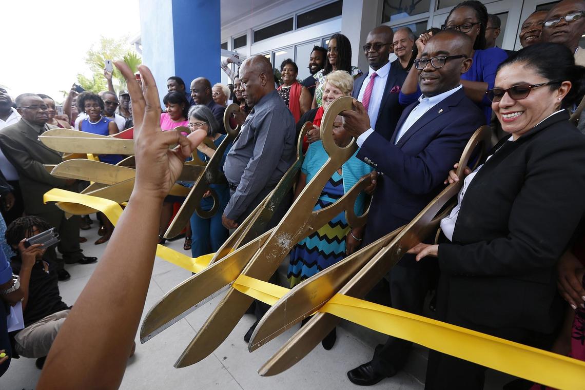 Miami-Dade County Commissioner Jean Monestime, District 2. and Maria Nardi, director of Miami-Dade County Parks, Recreation and Open Spaces Department, open the new Father Gérard Jean-Juste Community Center at Oak Grove Park. The North Dade facility was named in honor of the late Haitian cleric and activist who died at the age of 62 in 2009 in Miami.