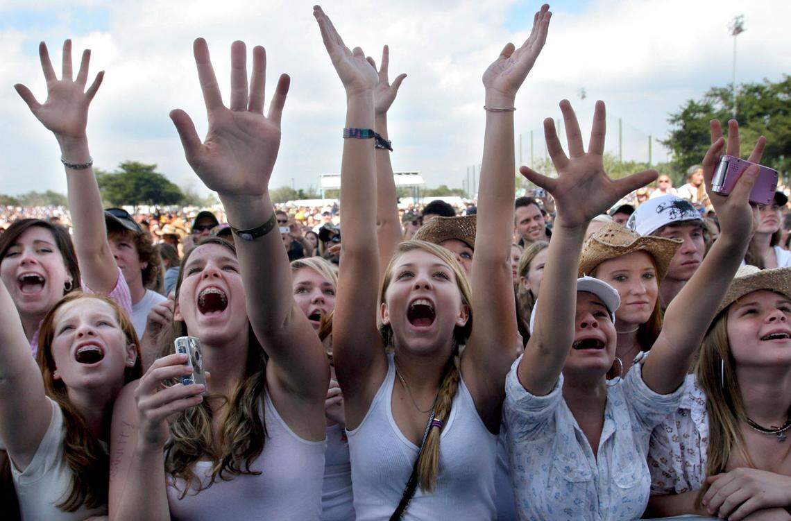 In this file photo from Jan. 27, 2008, Taylor Swift fans show enthusiasm for the then-teenage county music artist during Swift’s performance at the 23rd Annual 99.9 KISS County Chili Cookoff and concert at C. B. Smith Park. More than 20,000 country music fans and 87 chili cooking teams turned out for the concert and fair.