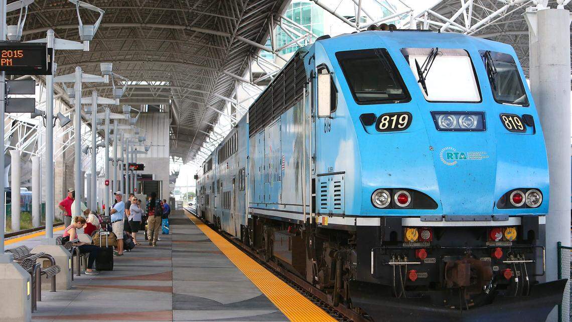 A view of people waiting at Miami Airport Tri-Rail Station in Miami on Friday, November 6, 2015.