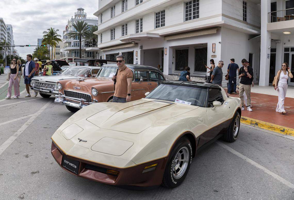 People make their way past a 1981 Corvette on display at the Classic Car Show during Art Deco Weekend at Ocean Drive on Saturday, Jan. 10, 2026, in Miami Beach, Fla.