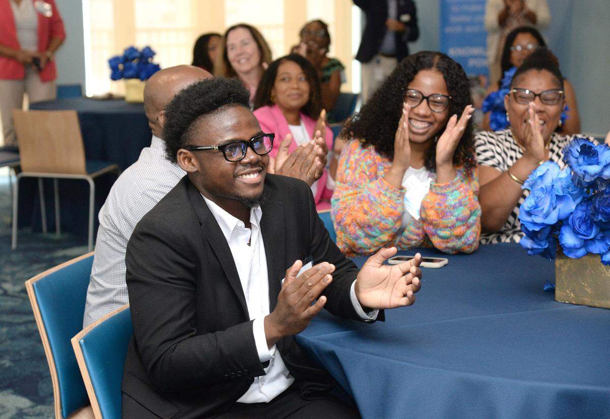 &nbsp;Samuel Jeanpierre, one of 10 recipients of the NextEra Energy Scholarship, is surprised on June 22 at a lunch for families and friends.