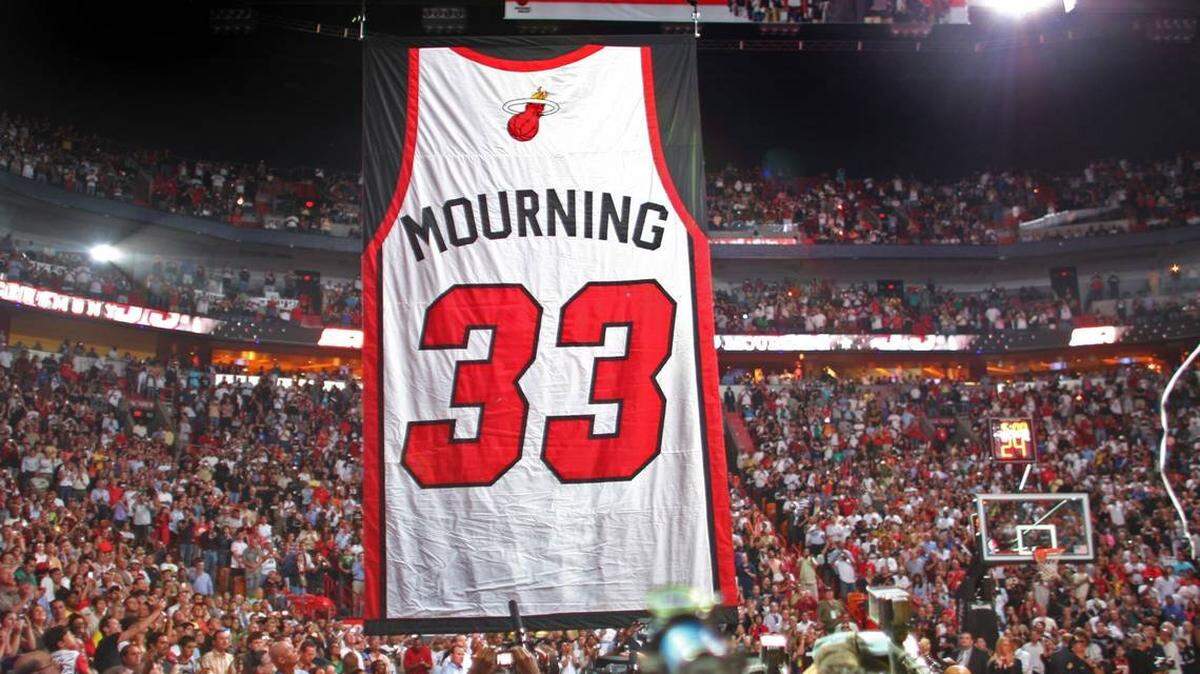 Former Miami Heat star Alonzo Mourning’s retired jersey heads to the rafters during a halftime ceremony of a game between the Heat and Orlando Magic in 2009.