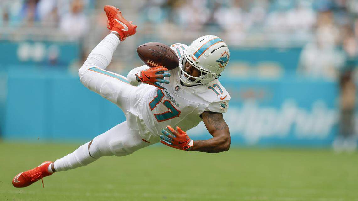 Miami Dolphins wide receiver Jaylen Waddle (17) catches a pass for a first down during their NFL football game against the Los Angeles Chargers at Hard Rock Stadium in Miami Gardens, FL, on Sunday, October 12, 2025.