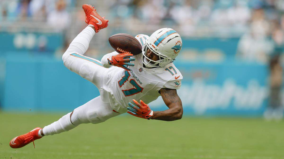 Miami Dolphins wide receiver Jaylen Waddle (17) catches a pass for a first down during their NFL football game against the Los Angeles Chargers at Hard Rock Stadium in Miami Gardens, FL, on Sunday, October 12, 2025.