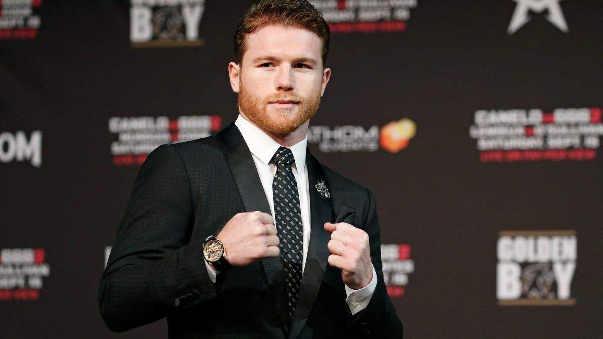 Canelo Alvarez strikes a pugilistic pose during a news conference Wednesday, Sept. 12, 2018, in Las Vegas.
