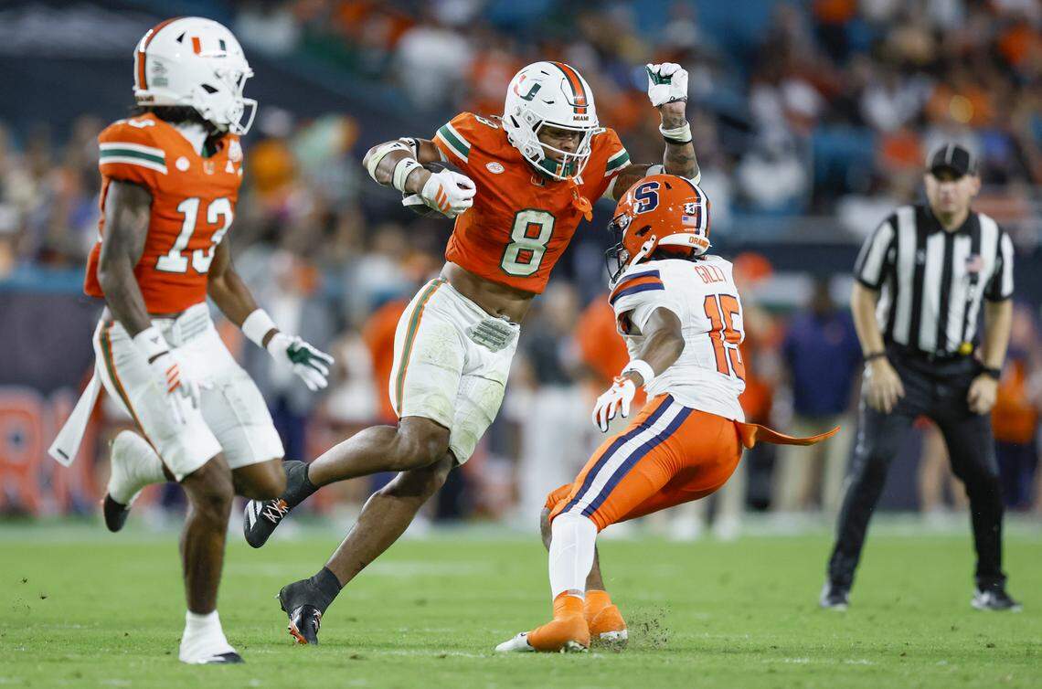 Miami Hurricanes defensive back Jakobe Thomas (8) returns an interception in the second half of an NCAA football game against the Syracuse Orange at Hard Rock Stadium in Miami Gardens, Florida on Saturday, November 8, 2025.