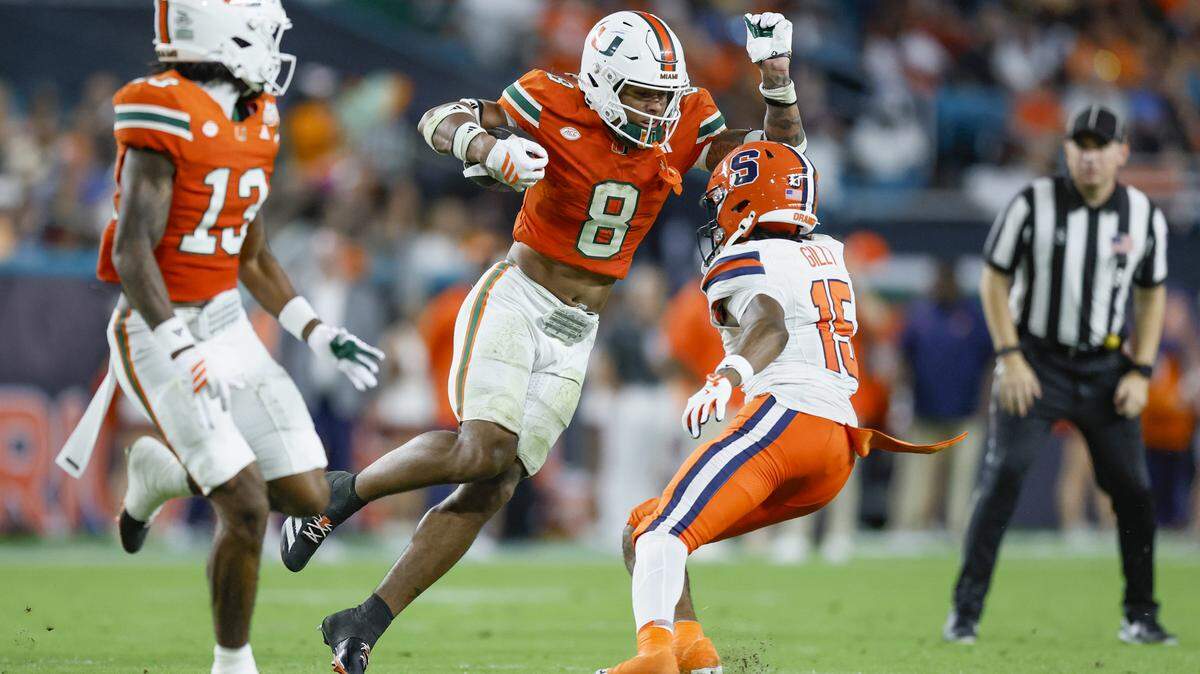 Miami Hurricanes defensive back Jakobe Thomas (8) returns an interception in the second half of an NCAA football game against the Syracuse Orange at Hard Rock Stadium in Miami Gardens, Florida on Saturday, November 8, 2025.