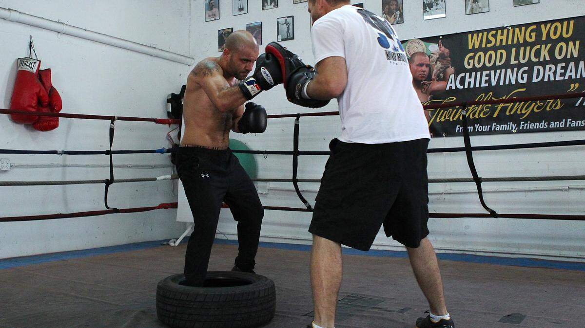 Cuban-American boxer Joey Hernandez works out with trainer Herman Caicedo.