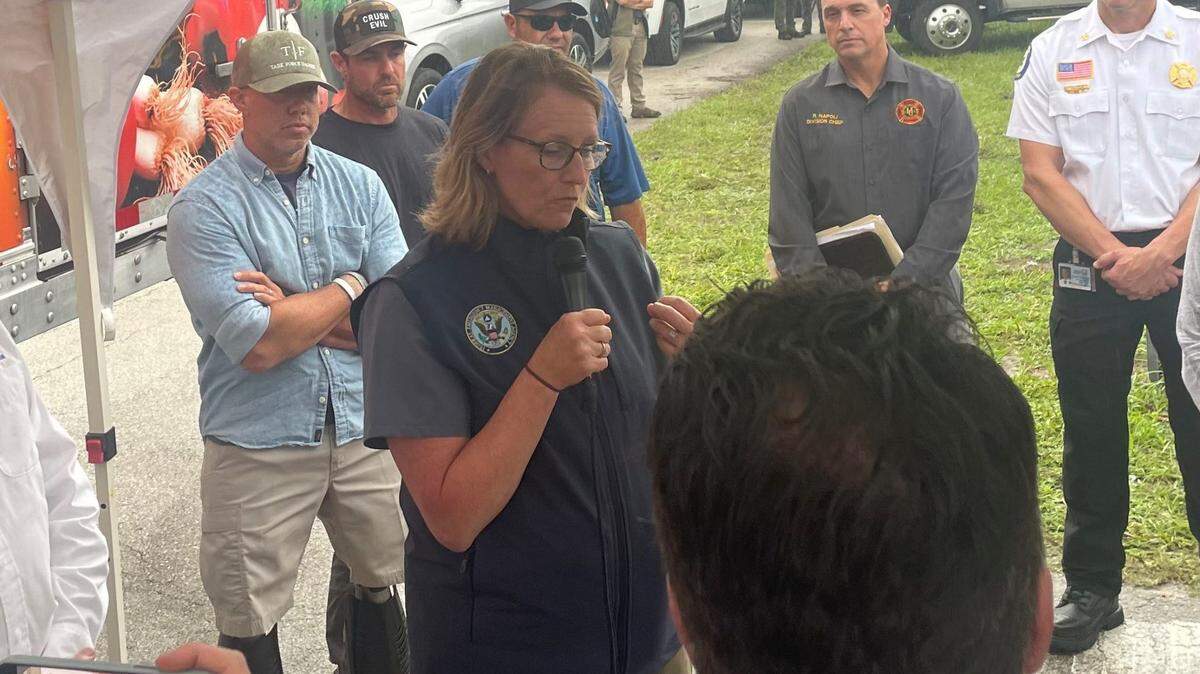 In this photo from Oct. 11, 2024, FEMA Administrator Deanne Criswell speaks to residents in Port Salerno after the community was hit by a suspected tornado and Hurricane Milton earlier in the week.