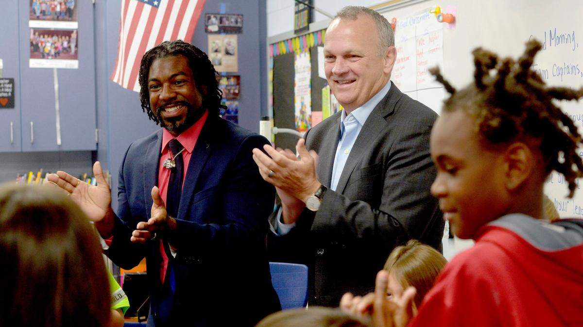 Florida Department of Education Commissioner Richard Corcoran, right, plays a name game with Dakeyan “Dre” Graham, Florida Teacher of the Year on Thursday, Aug. 15, 2019, for second-graders at Riverside Elementary in Crestview, Fla.