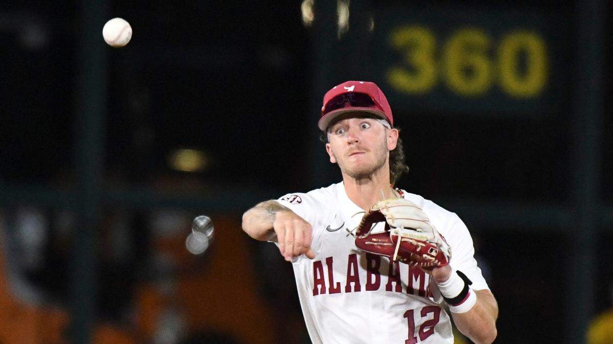 Mar 15, 2024; Tuscaloosa, Alabama, USA; Alabama infielder Gage Miller throws to first to record an out against Tennessee at Sewell-Thomas Stadium in the first game of the SEC season for both teams.