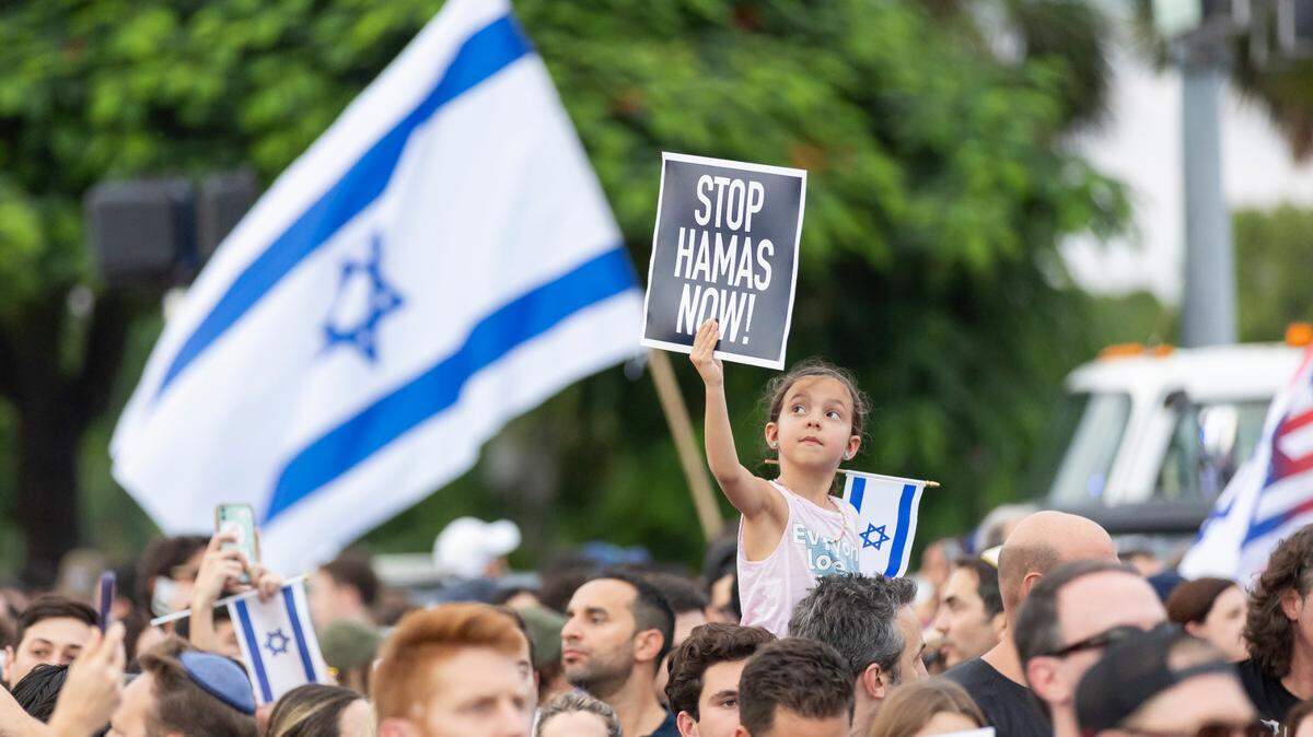 South Florida residents attend a show of solidarity with Israel rally at the Holocaust Memorial on Miami Beach.