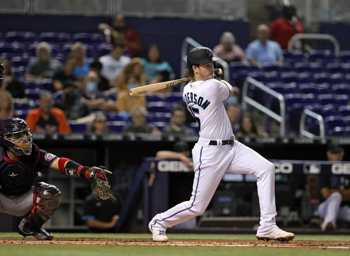 Miami Marlins third baseman Brian Anderson (15) hits a RBI single during the first inning of their baseball game against the Washington Nationals at loanDepot park on Thursday, August 26, 2021 in Miami, Florida.