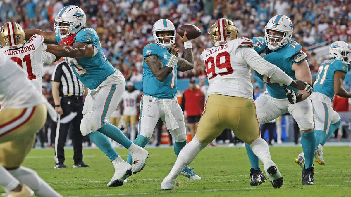 Miami Dolphins quarterback Tua Tagovailoa (1) sets up to pass against the San Francisco 49ers during the first half of an NFL Football game at Hard Rock Stadium in Miami Gardens, Florida, on Sunday, December 22, 2024.