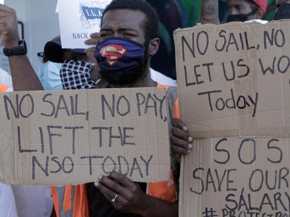 A protester holds a sign urging the end to the no-sail order on Monday, September 28, 2020, as a group of longshoremen, travel agents and other professionals who depend on the cruise industry for employment held a rally at PortMiami Terminal D to urge the CDC to lift the no-sail order for cruising and allow the industry to restart.
